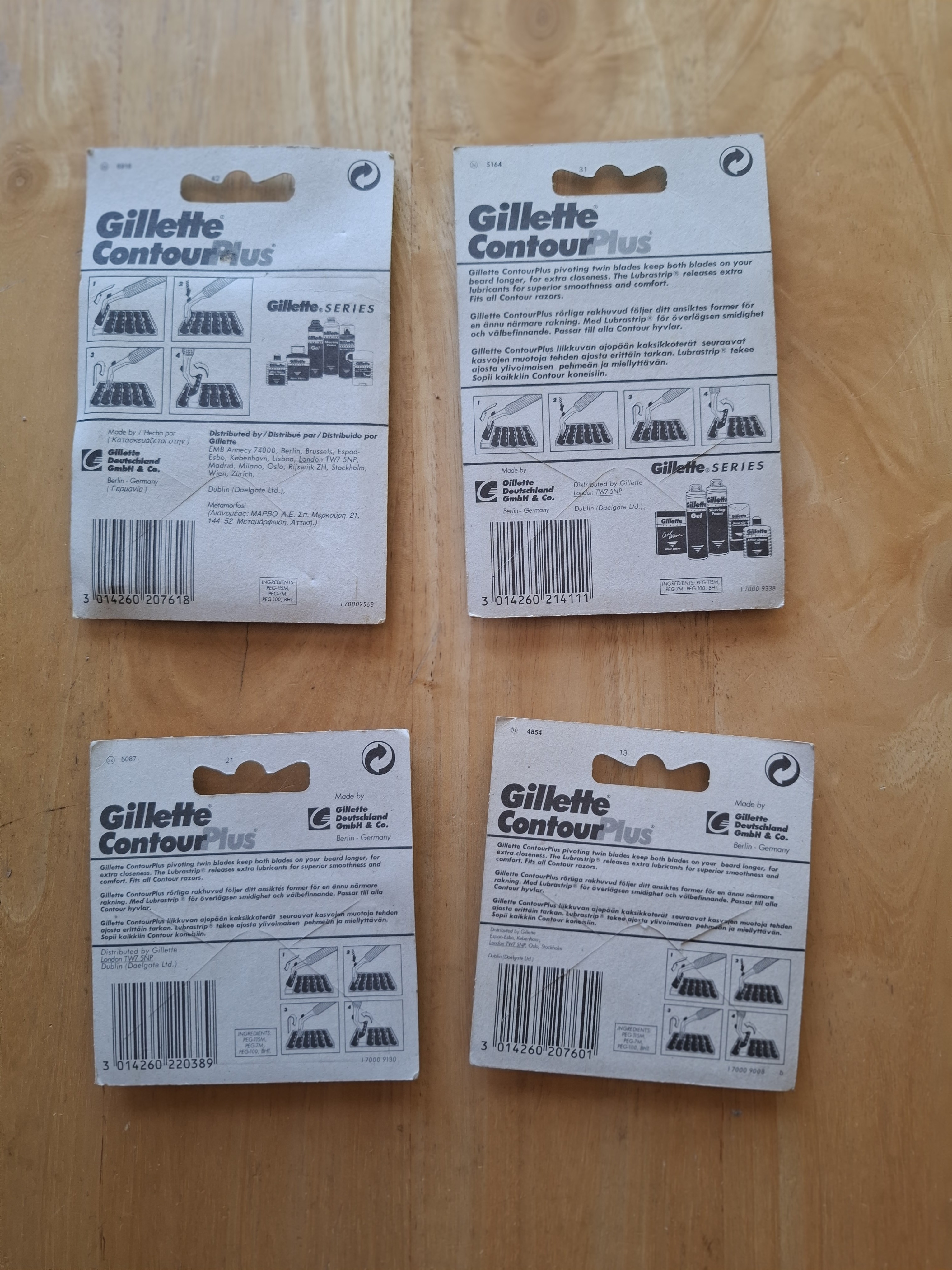 Four Gillette Contour Plus card backs, showing barcode, batch code and distributor print variants